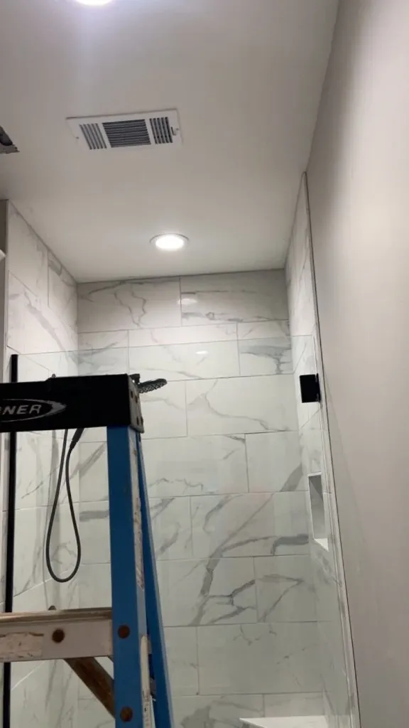 Walk-in shower framing and tile prep against finished drywall